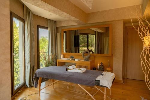 a hospital room with a bed and a mirror at Lale Boutique Hotel in Sapanca