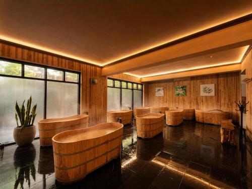a room with a row of chairs and tables at Cuc Phuong Mineral Retreat in Ninh Binh