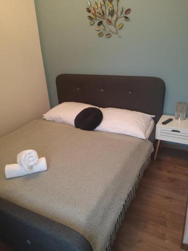 a bed with two towels on top of it at Főnix Badacsony in Badacsonytomaj