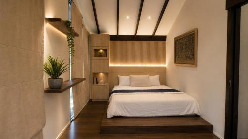 a bedroom with a bed in a room at The Haven 3BR Private Pool Lembang in Tegalharendong