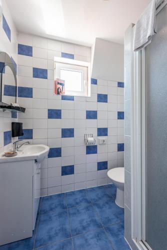 a bathroom with a sink and a toilet at Penzion Maja in Martin