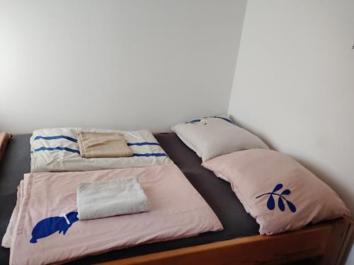 a bed with two pillows on top of it at Cimra in Varnsdorf