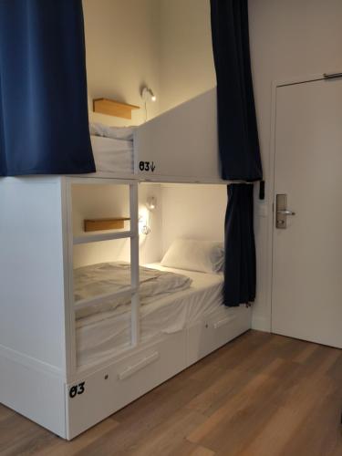 a bedroom with a bunk bed in a room at SLO Hostel Lyon Saxe in Lyon