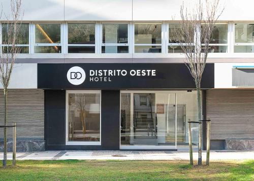 an office building with a sign that reads districtotide officellor at Hotel Distrito Oeste by Limehome in San Sebastián