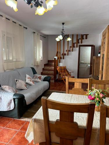 a living room with a couch and a table at Casa Rural Mi Medina in Medina Sidonia