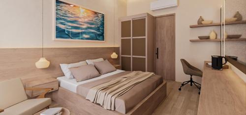a bedroom with a bed and a desk and a chair at The Sultanate Fulhadhoo Baa Atoll in Fulhadhoo