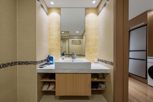 a bathroom with a sink and a mirror at 栖雅民宿 in Beijing