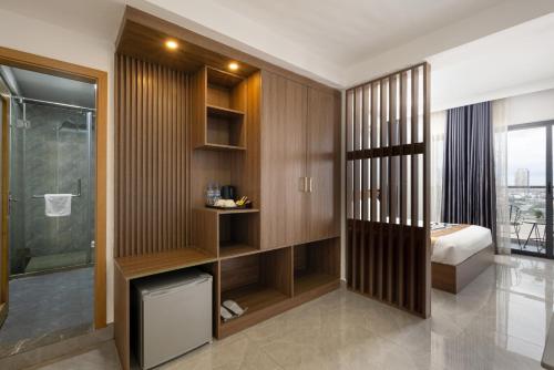a bathroom with wood paneling and a bed and a shower at M9 Kirirom Hotel in Phnom Penh