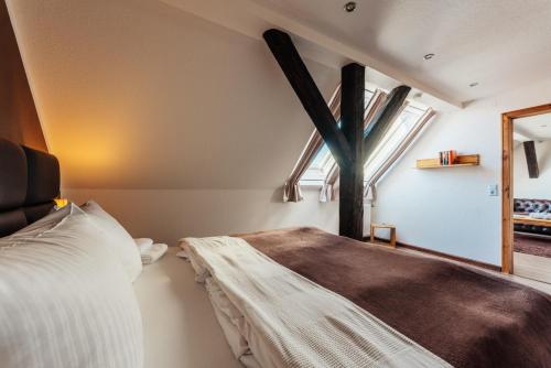 a bedroom with a bed and a large window at Fichtenblick in Sankt Andreasberg