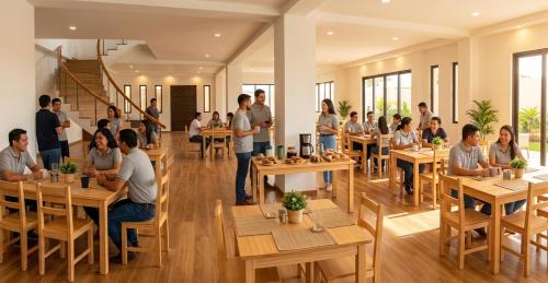a group of people sitting at tables in a restaurant at Hangar pista36 in Hacienda Santa Rosa