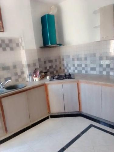 a kitchen with a sink and a counter top at دار المحبة - Dar El Mahabba in Tazarka