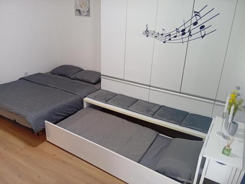 a bedroom with two bunk beds in a room at Apartment S&S Tomislavgrad in Tomislavgrad