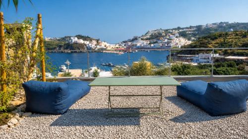 a table and two chairs with a view of the water at Maridea - Villa Zagara in Ponza