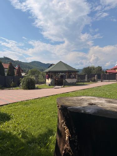a park with a gazebo in the background at Casa Petrişor in Corbi