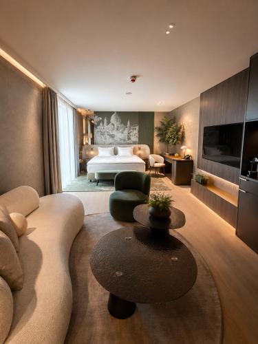 En eller flere senge i et værelse på GW Danube Hotel