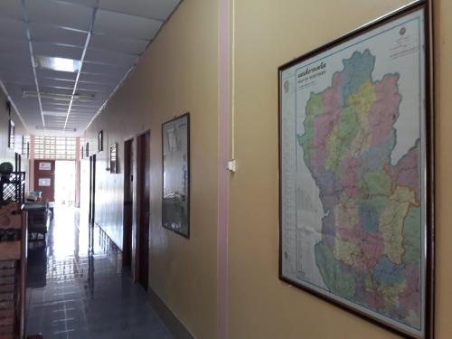 a large map hanging on a wall in a hallway at Vitoonguesthouse2fanrooms & Aircondition in Sukhothai