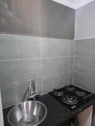 a kitchen with a sink and a stove at The Good Samaritan 4 in eMalahleni
