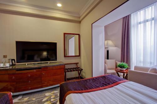 Ένα ή περισσότερα κρεβάτια σε δωμάτιο στο Hotel Lulu