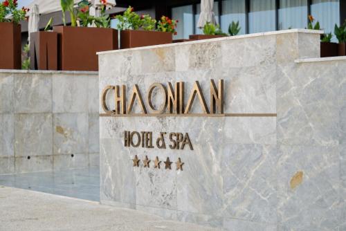 a sign for the chamonix hotel and spa at Chaonian Hotel in Dhërmi
