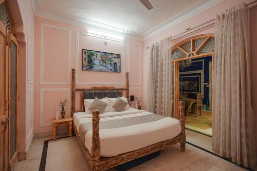 a bedroom with a bed in a room with a doorway at Wanderlust A Boutique Homestay in Udaipur