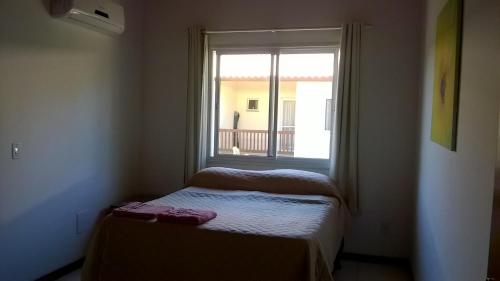 Ένα ή περισσότερα κρεβάτια σε δωμάτιο στο Cote Dazur Residence Imbassai