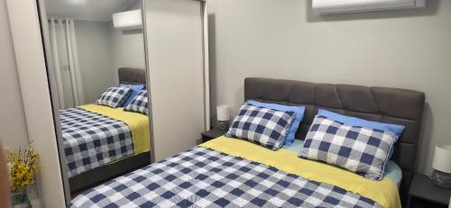 a bedroom with a bed and a mirror at Villa View in Neum