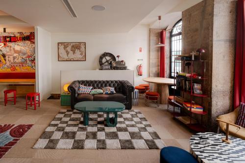a living room with a couch and a table at Yes Lisbon Hostel in Lisbon