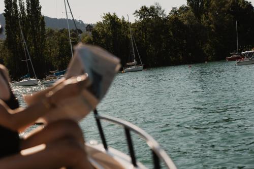 a person sitting on a boat in the water at Park Hyatt Zurich – City Center Luxury in Zurich