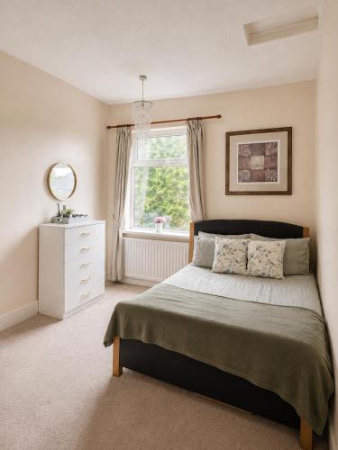 a bedroom with a large bed and a window at Spacious Double Room In Central Stoke in Stoke on Trent