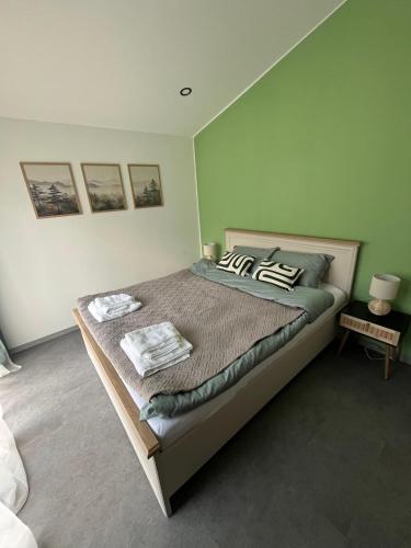 a bedroom with a large bed in a room at Chalet 1602 in Avrig