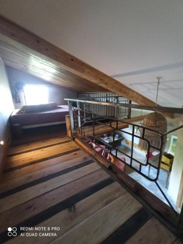 an overhead view of a room with wooden stairs at Gîte au calme 