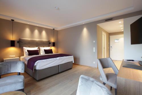 Postel nebo postele na pokoji v ubytování Hotel Aurelia