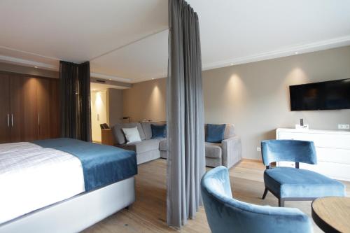 Postel nebo postele na pokoji v ubytování Hotel Aurelia