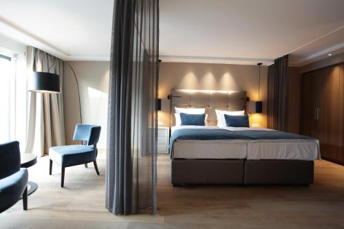 Postel nebo postele na pokoji v ubytování Hotel Aurelia