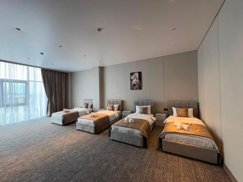 a bedroom with four beds in a room at Polaris resort in Almaty