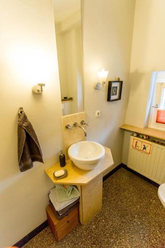 a bathroom with a white sink and a mirror at finkeshaus in Lüdinghausen