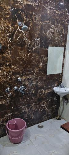 a bathroom with a sink and a bath tub at The duggar villa in Jammu