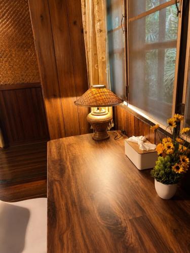 a lamp sitting on top of a table in a room at Thai house in Chaweng in Nathon Bay