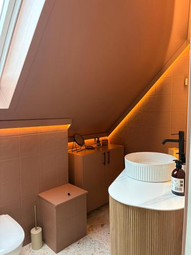 a bathroom with a sink and a toilet at Lake House in Vossevangen