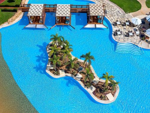 an aerial view of a resort with a pool at Rixos Sharm El Sheikh - Adults Only 18 Plus in Sharm El Sheikh