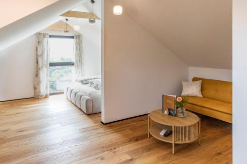a living room with a couch and a table at Weingut Peter Grill in Leutschach