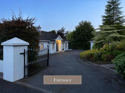 an entrance to a house with a fence at Sonas in Letterkenny