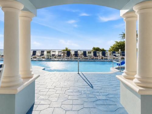 a view of the pool from the balcony of a resort at Hollywood Beach Tower in Hollywood