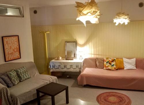 a living room with a couch and a table at 2 Bedroom-Boho-Style-Apartment in Sankt Veit an der Glan