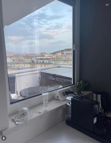 a window in a room with a view of a balcony at 18 Dante Luxury Suites in Cagliari