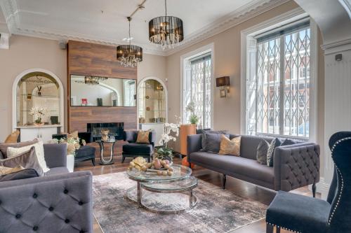 a living room with a couch and a table at Wakefield Town House Accomodation in Wakefield