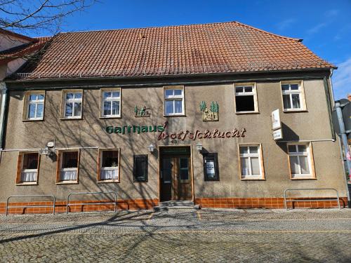 a building with a sign on the side of it at Gasthaus Wolfsschlucht in Herzberg