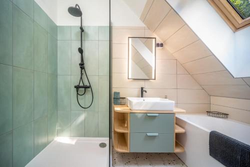a bathroom with a sink and a shower at Rita Apartman in Balatonföldvár
