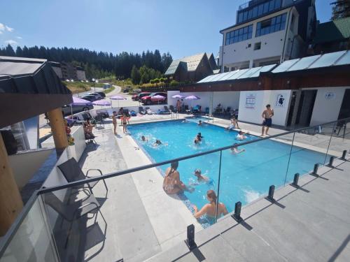 a group of people in a swimming pool at Meandri in Nova Varoš