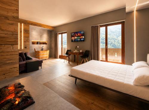a bedroom with a bed and a living room at Agarthi Suites in Piateda